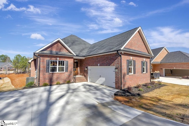 118 Bonaire Pt, Anderson, SC 29621 - view of front facade featuring an attached garage, cooling unit, brick siding, concrete driveway, and roof with shingles