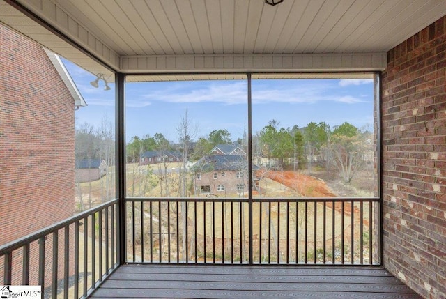 unfurnished sunroom featuring wood ceiling