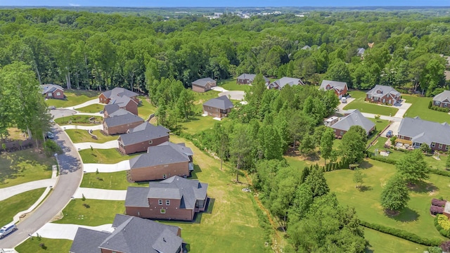 aerial view with a residential view and a wooded view