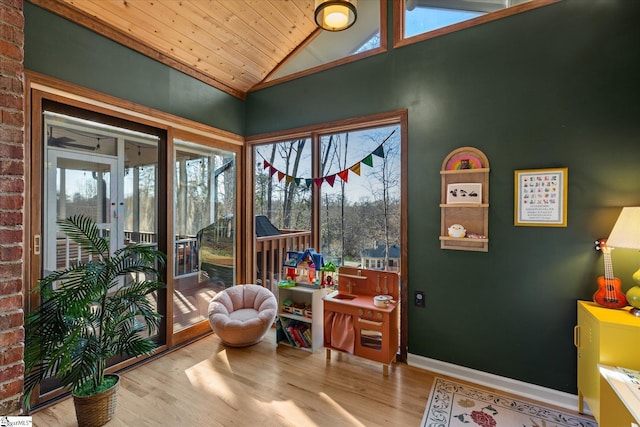 sunroom with wooden ceiling and vaulted ceiling