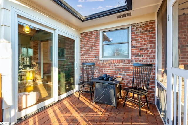 wooden deck with visible vents