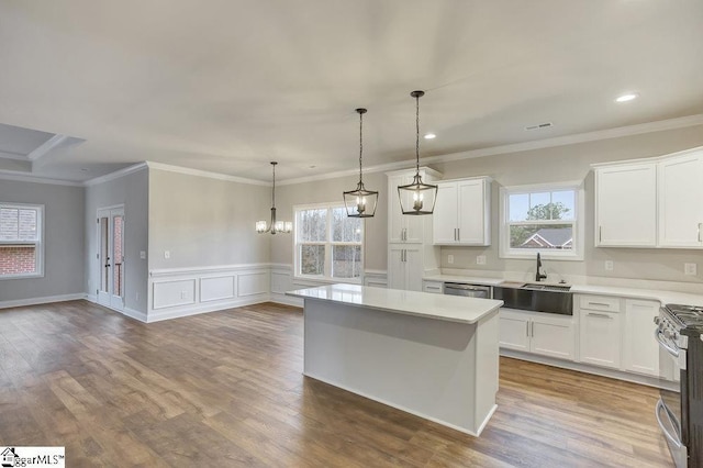 120 Bonaire Pt, Anderson, SC 29621 - kitchen featuring light countertops, a center island, white cabinetry, and a sink