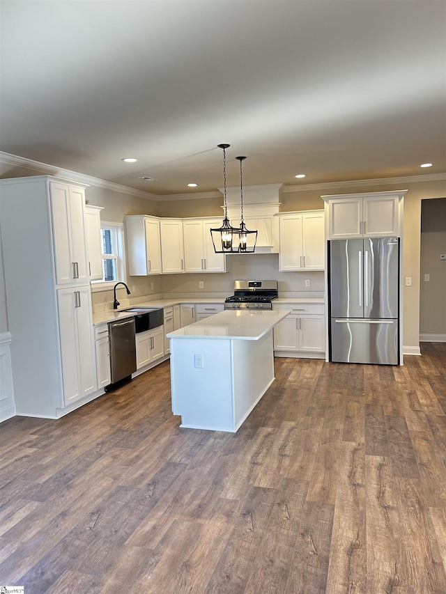120 Bonaire Pt, Anderson, SC 29621 - kitchen featuring white cabinets, a center island, stainless steel appliances, light countertops, and pendant lighting