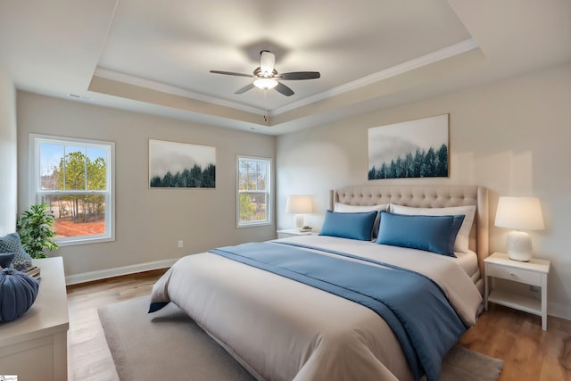 120 Bonaire Pt, Anderson, SC 29621 - bedroom featuring a tray ceiling, light wood-type flooring, and baseboards