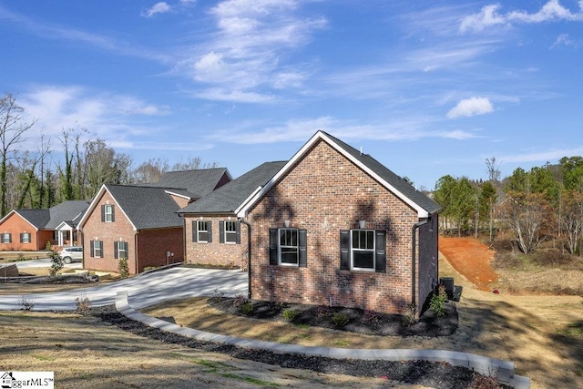 view of front of house featuring brick siding