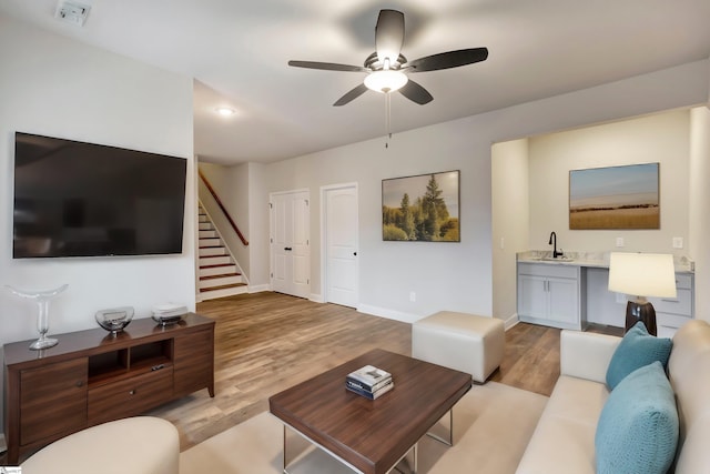120 Bonaire Pt, Anderson, SC 29621 - living room featuring light wood-style floors, baseboards, stairway, and a ceiling fan