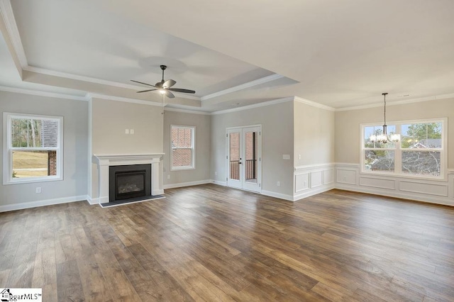 120 Bonaire Pt, Anderson, SC 29621 - unfurnished living room with a wealth of natural light, a tray ceiling, and wood finished floors