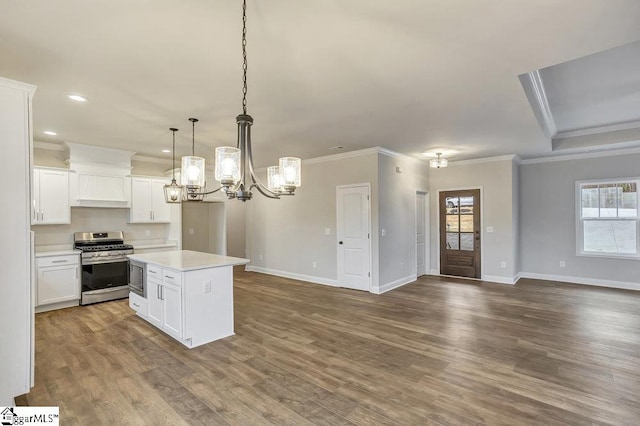 120 Bonaire Pt, Anderson, SC 29621 - kitchen with a center island, stainless steel appliances, light countertops, open floor plan, and white cabinetry