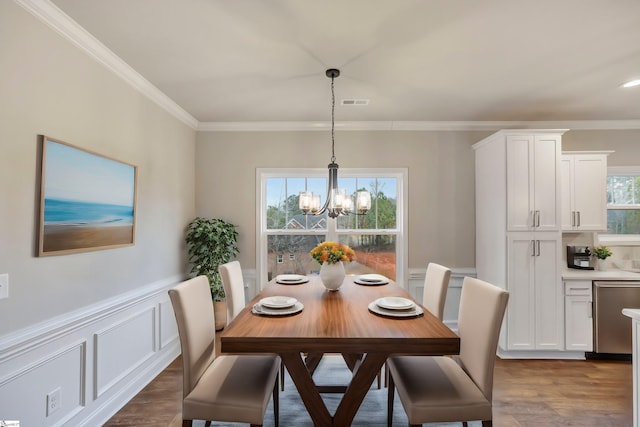 120 Bonaire Pt, Anderson, SC 29621 - dining space with visible vents, dark wood finished floors, wainscoting, ornamental molding, and a chandelier