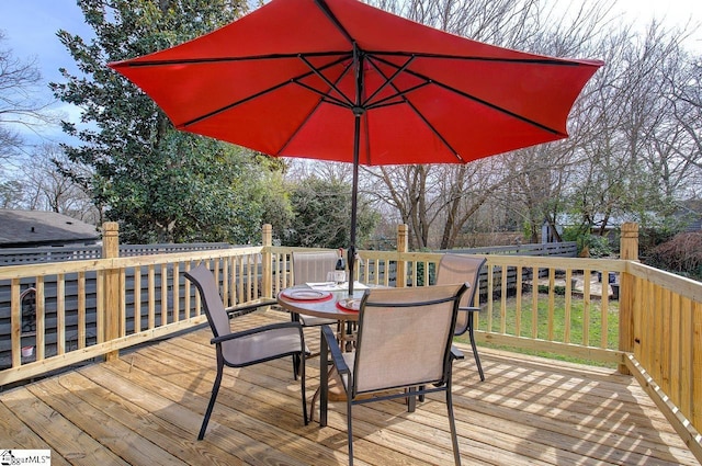 deck featuring outdoor dining area