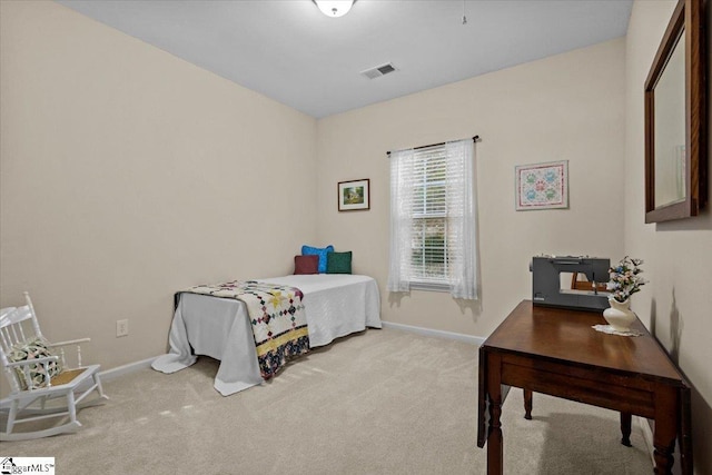 bedroom featuring light colored carpet, visible vents, and baseboards