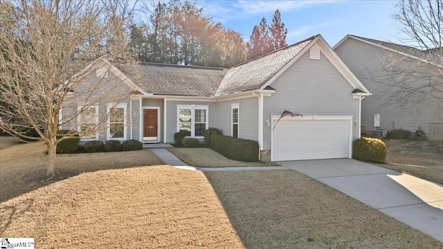 view of front facade featuring central air condition unit, a garage, a shingled roof, concrete driveway, and a front yard