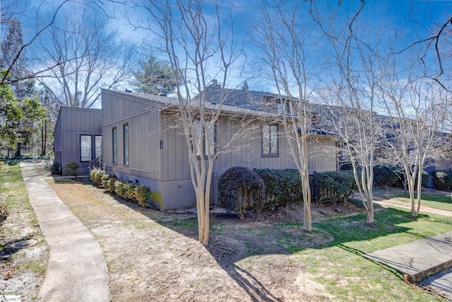 view of property exterior featuring a chimney