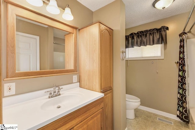 full bath with a textured ceiling, toilet, vanity, visible vents, and a closet