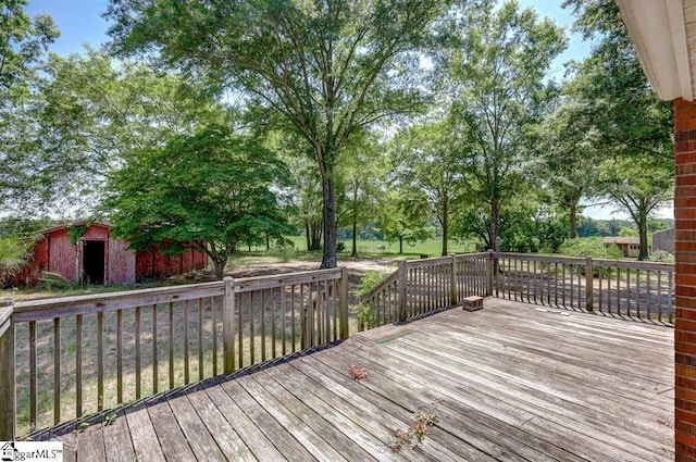 wooden terrace with a shed and an outdoor structure