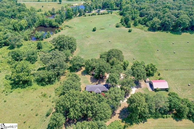 birds eye view of property with a rural view and a water view