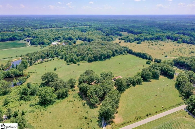 birds eye view of property with a rural view