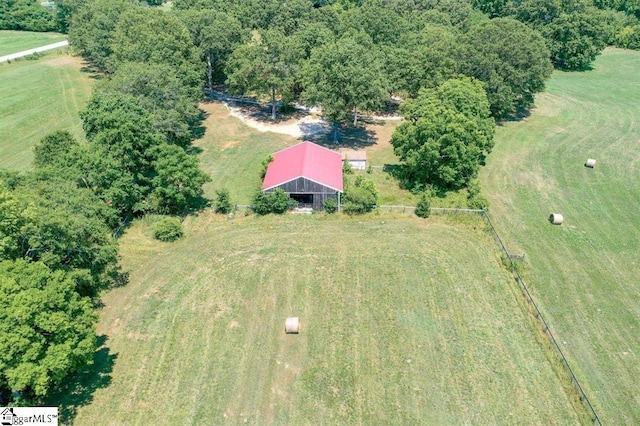 birds eye view of property with a rural view