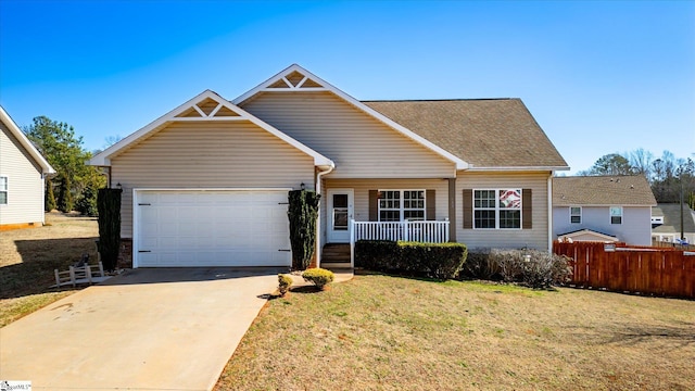 view of front facade with covered porch, a garage, fence, concrete driveway, and a front lawn