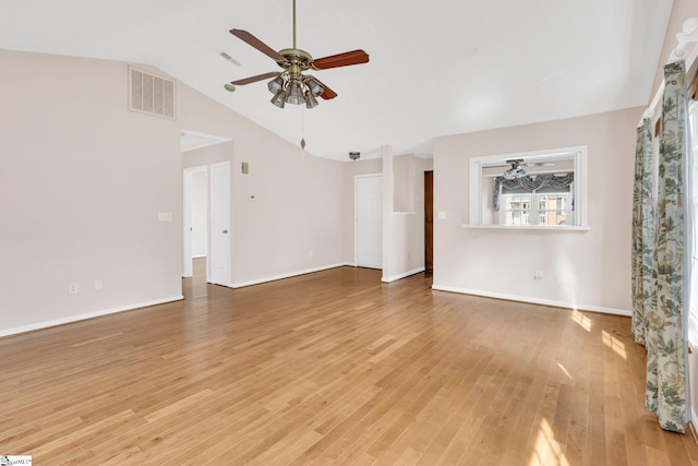 unfurnished living room featuring lofted ceiling, visible vents, ceiling fan, wood finished floors, and baseboards