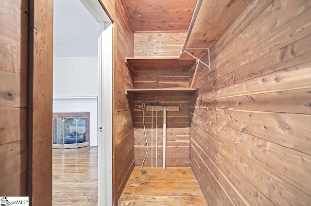 spacious closet featuring wood finished floors