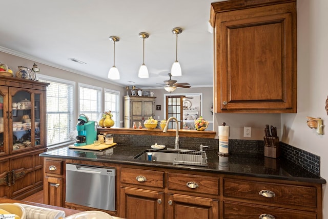 kitchen with a sink, ornamental molding, dishwasher, brown cabinetry, and pendant lighting