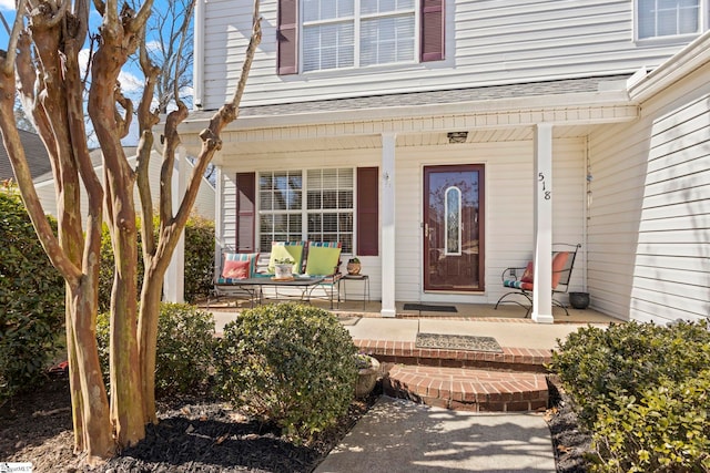 doorway to property with a porch