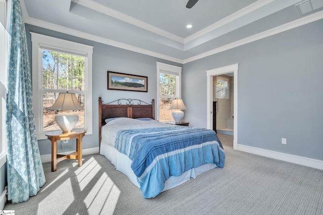 bedroom featuring carpet flooring, a raised ceiling, visible vents, and baseboards