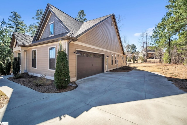 view of home's exterior with driveway and an attached garage