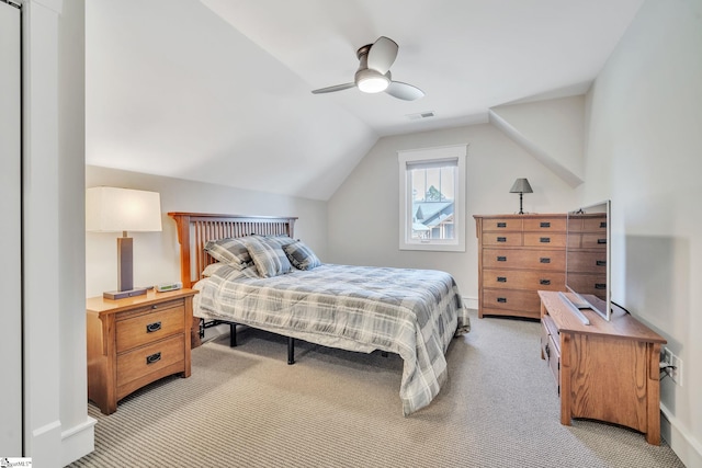 bedroom featuring ceiling fan, lofted ceiling, light carpet, visible vents, and baseboards