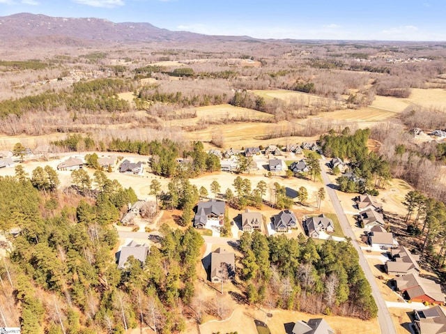 drone / aerial view featuring a residential view and a mountain view