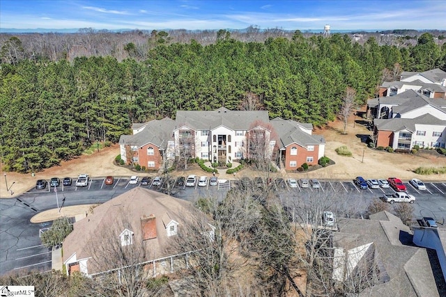 bird's eye view with a residential view and a view of trees