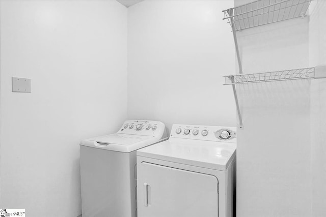 laundry area featuring laundry area and separate washer and dryer