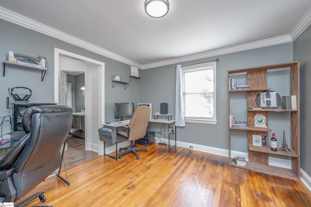 office with ornamental molding, baseboards, and wood finished floors