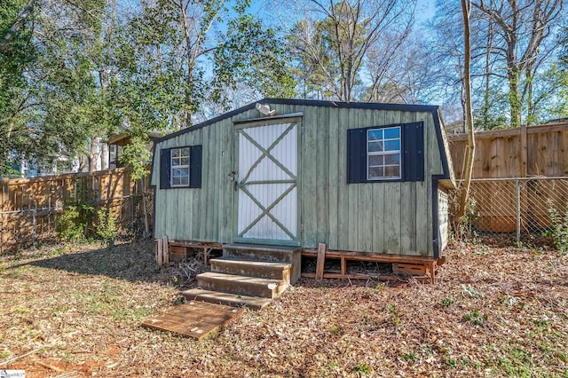 view of shed featuring a fenced backyard