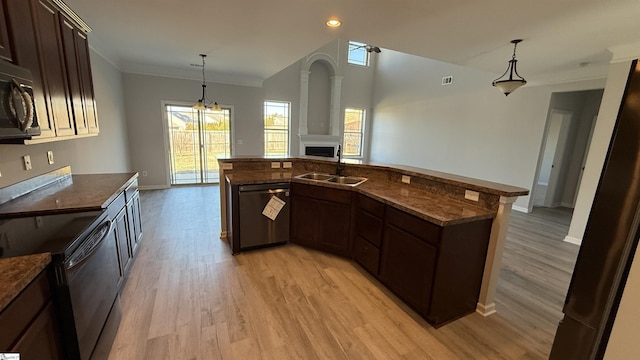 kitchen featuring dishwashing machine, black range with electric stovetop, a sink, open floor plan, and hanging light fixtures