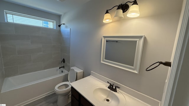 full bathroom with shower / bathtub combination, vanity, and toilet