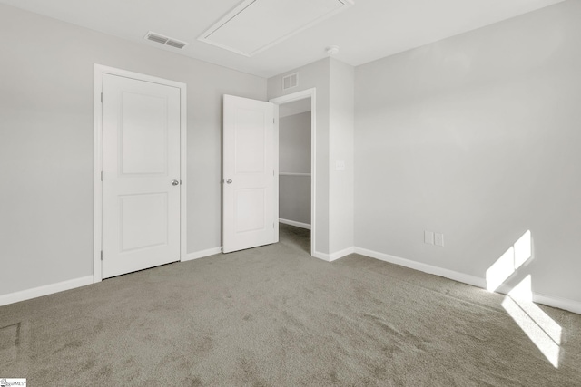 unfurnished bedroom with baseboards, visible vents, and carpet floors