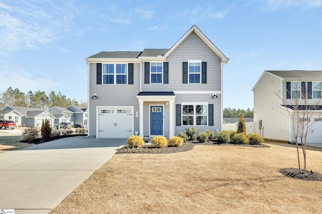 view of front of home featuring concrete driveway and a garage