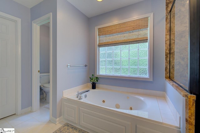 bathroom with a whirlpool tub, toilet, and tile patterned floors