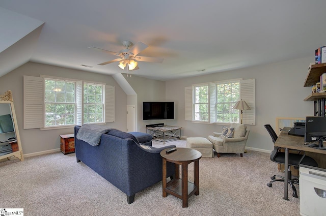 living area with a healthy amount of sunlight, visible vents, baseboards, and light colored carpet