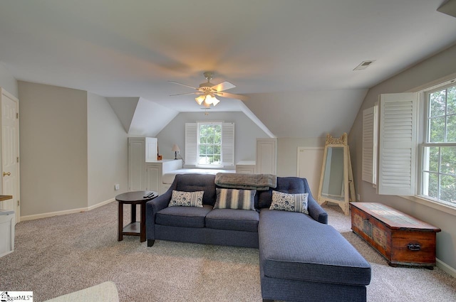 living room with ceiling fan, lofted ceiling, light carpet, visible vents, and baseboards