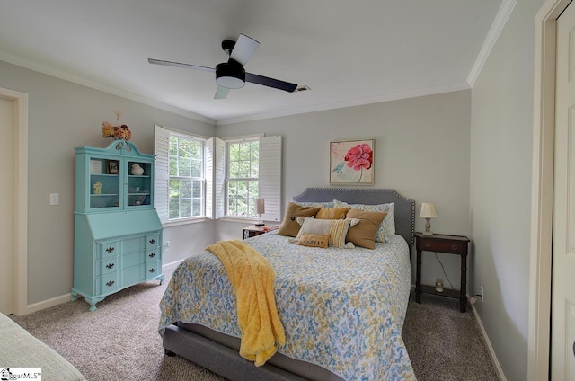 carpeted bedroom featuring ornamental molding, baseboards, and a ceiling fan