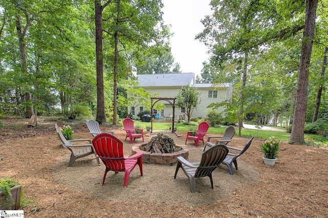 view of patio featuring an outdoor fire pit and a pergola