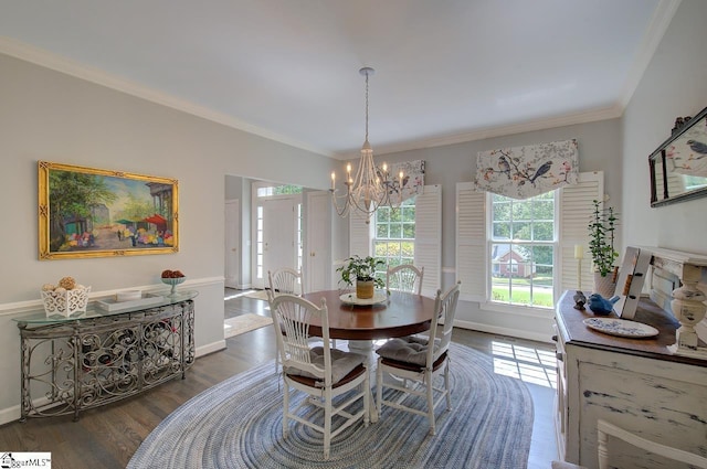 dining area with ornamental molding, baseboards, an inviting chandelier, and dark wood-style floors