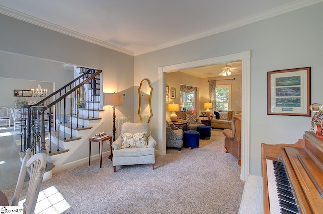 sitting room featuring light colored carpet, baseboards, stairs, an inviting chandelier, and crown molding