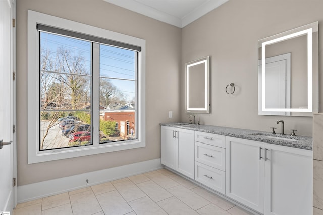 full bath with a healthy amount of sunlight, a sink, and double vanity