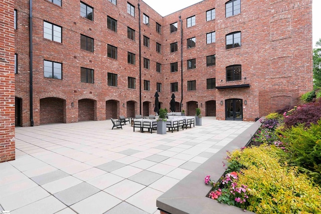 view of property's community with a patio area