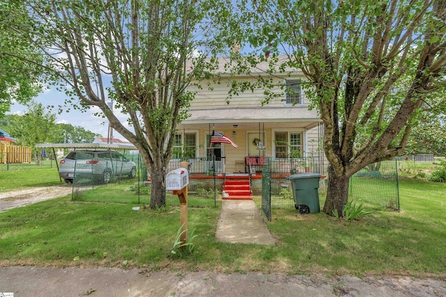 view of front of house featuring a porch, a front yard, and roof with shingles