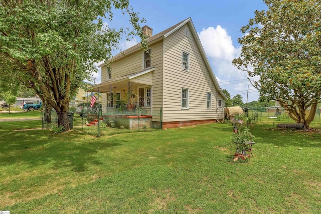 view of home's exterior featuring a lawn, a chimney, and fence